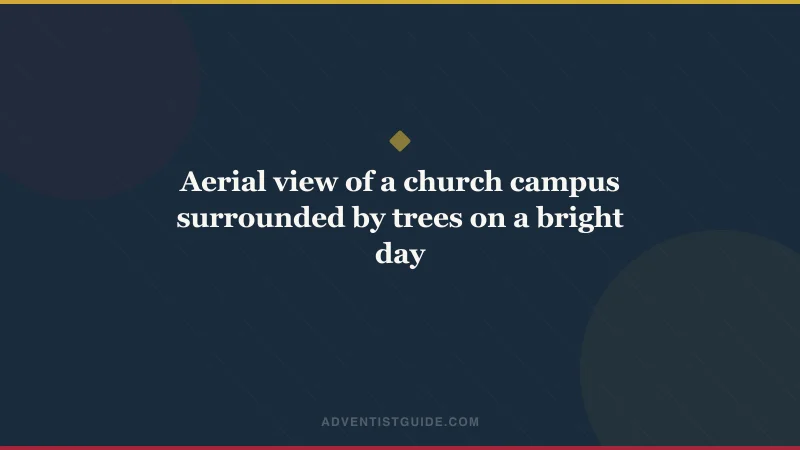 Aerial view of a church campus surrounded by trees on a bright day