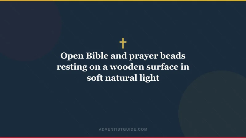 Open Bible and prayer beads resting on a wooden surface in soft natural light