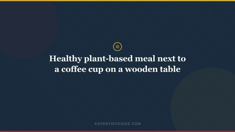 Healthy plant-based meal next to a coffee cup on a wooden table
